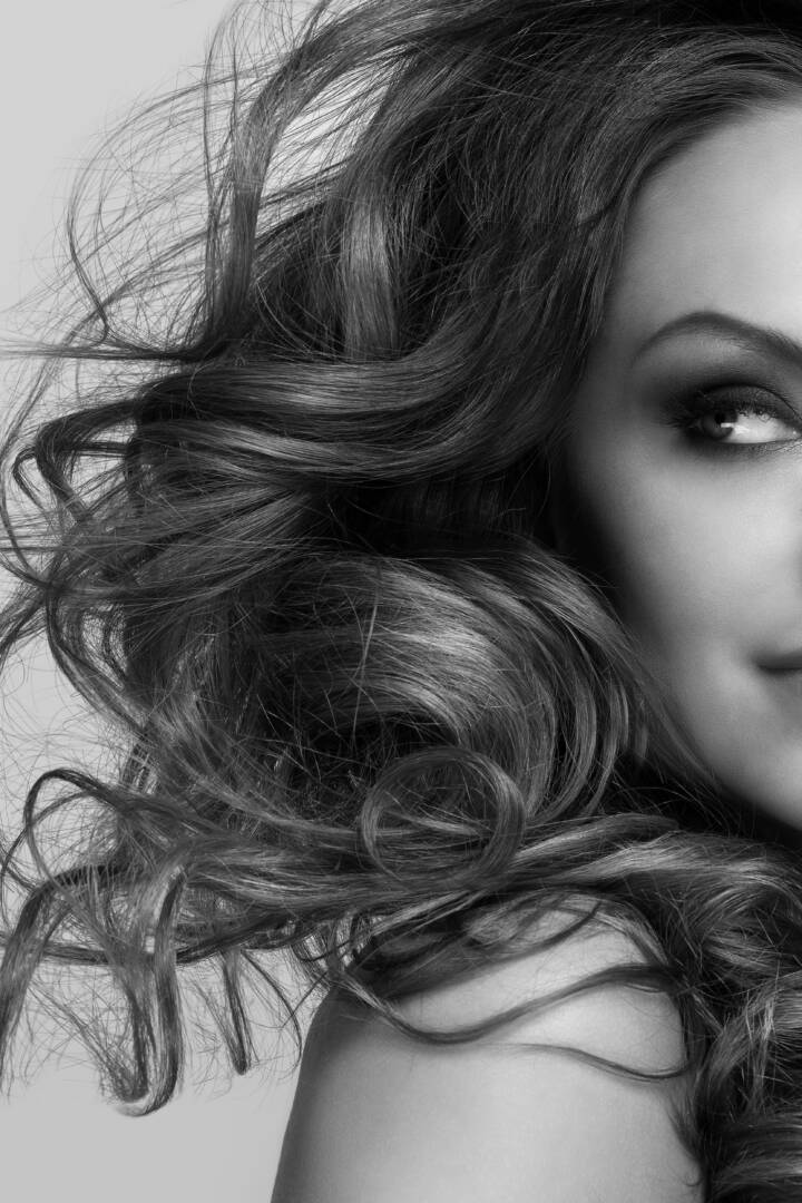 Beautiful woman with curls and makeup